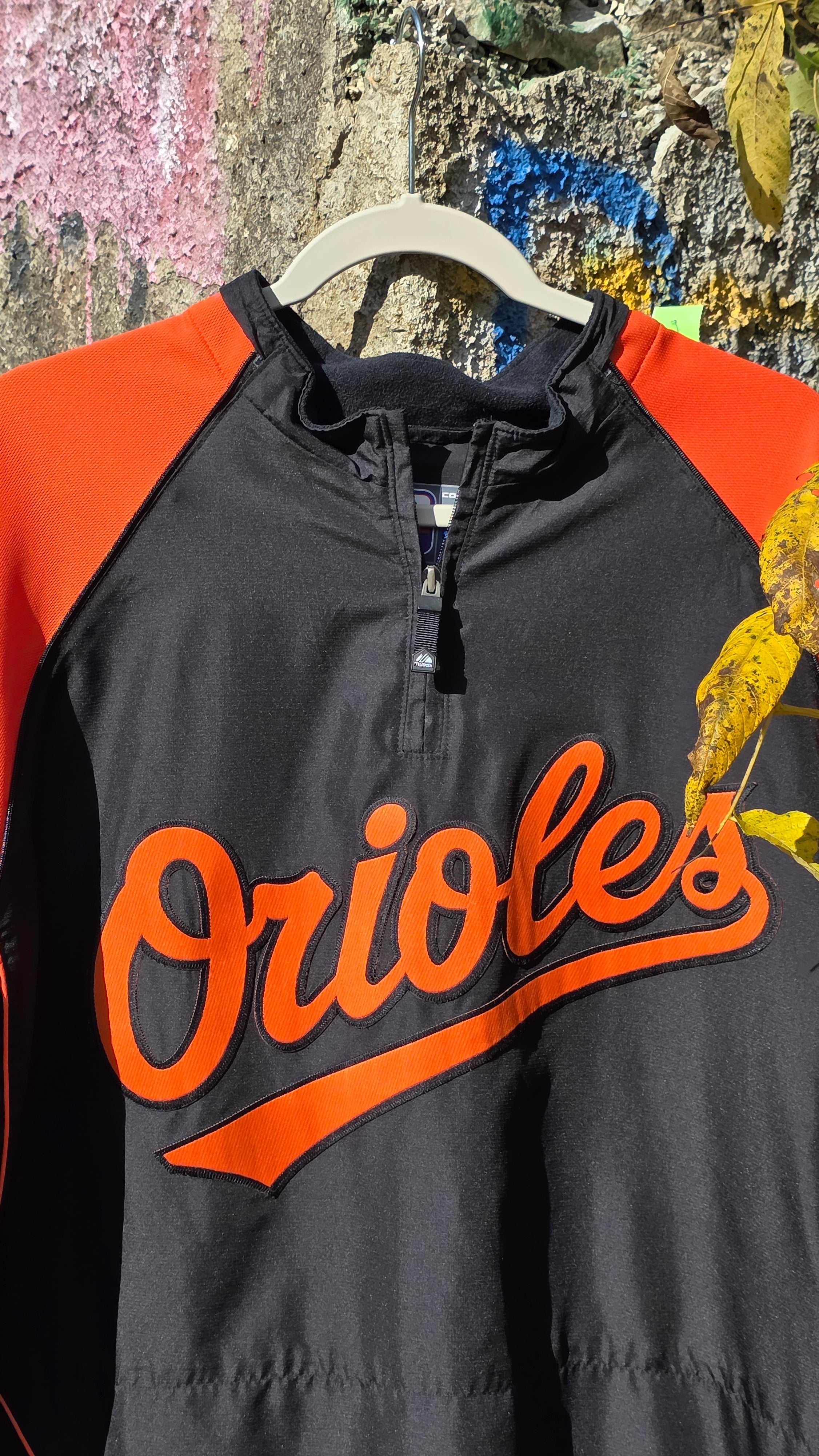 Orioles quarter-sleeve windbreaker. Size large