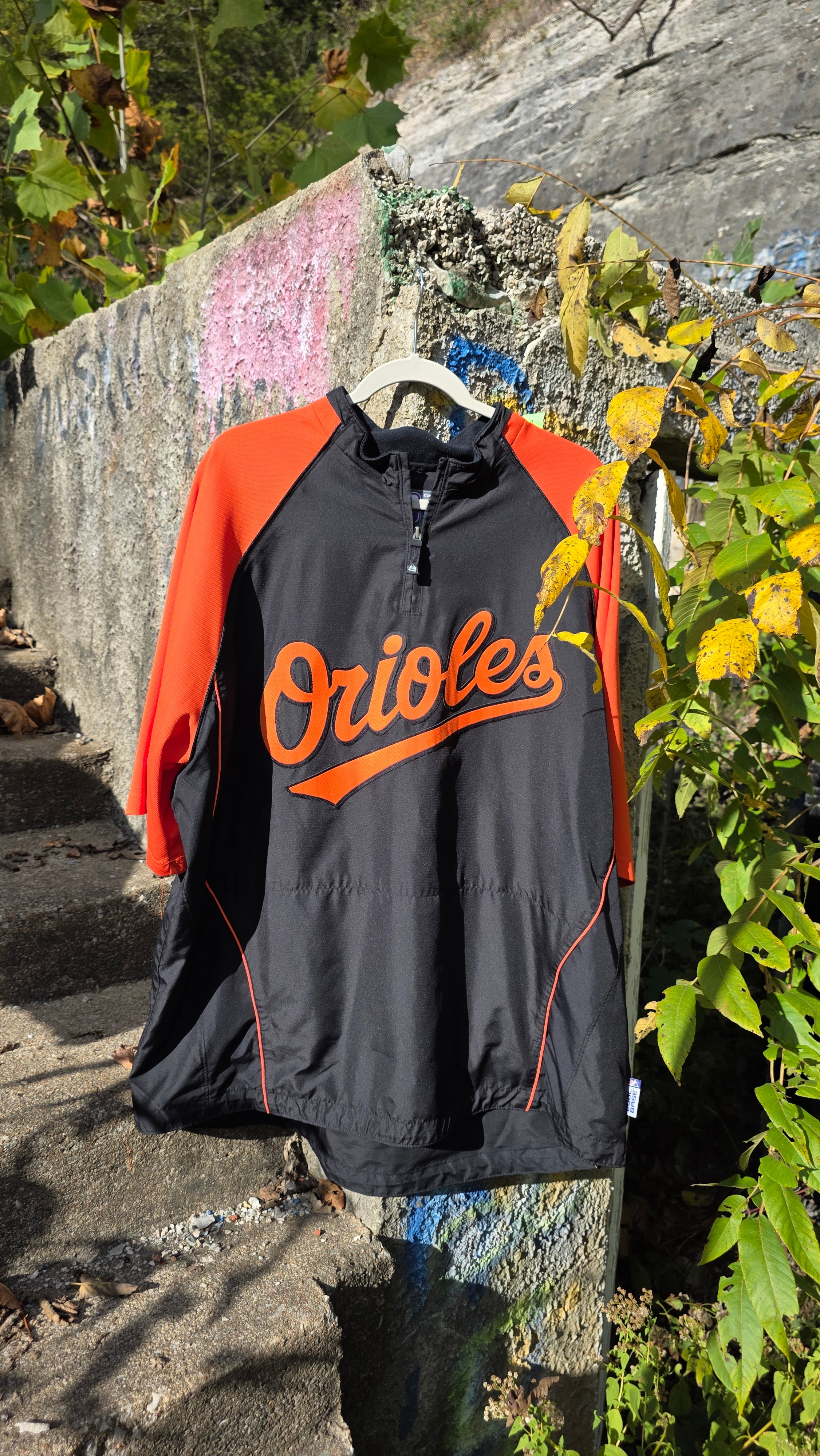 Orioles quarter-sleeve windbreaker. Size large